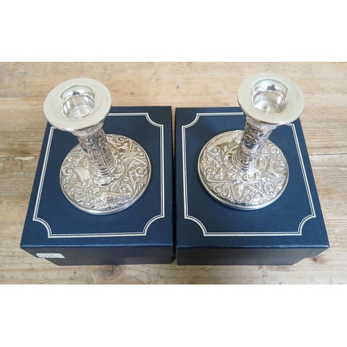 216 - A pair of modern hallmarked silver filled candlesticks, height 10cm, with boxes.