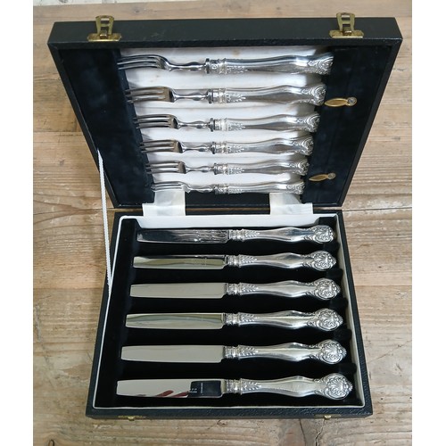 220 - A cased set of 12 hallmarked silver handle knifes and forks.