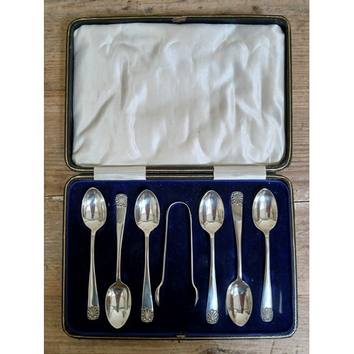 221 - A cased set of hallmarked silver teaspoons and sugar tongs.