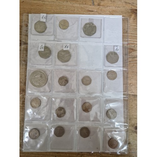 311 - A file of assorted collectable 50p & 20p coins.