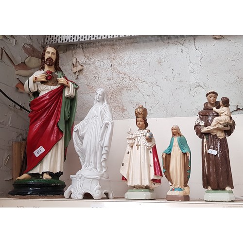 550 - Four plaster religious statues and a parian ware one, tallest approx 57cm