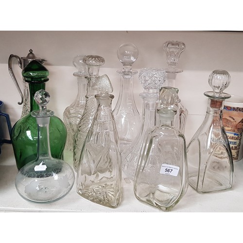 567 - 10 decanters and a claret jug