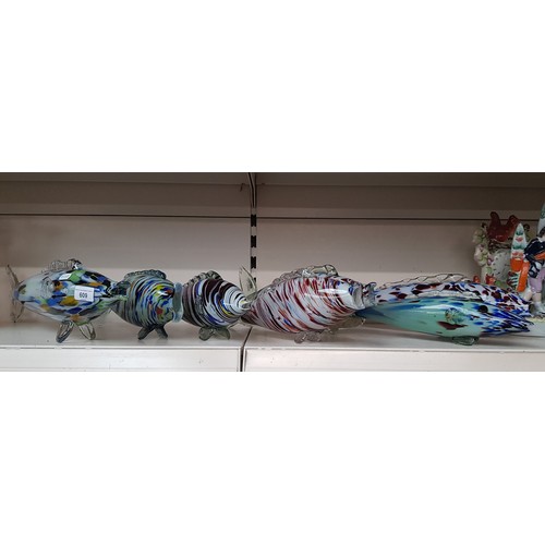 609 - Seven multi coloured art glass fish.