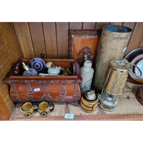 17 - A mixed lot of collectables; brass miner's lamp, shell case, Guinness table lighter and miniature ta... 