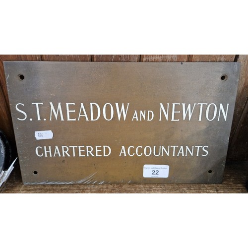 22 - A brass business name plate, 'Meadow & Newton, Chartered Accountants'