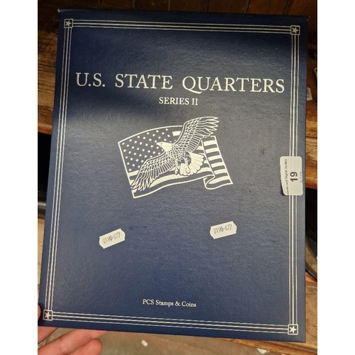 19 - A file of state quarters, yellowstone park.