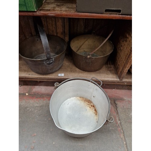 56 - Two brass jam pans together with an aluminium jam pan.