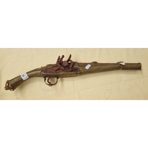 39 - An Indian brass non working replica pistol.