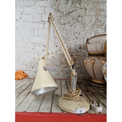 83 - A cream anglepoise lamp