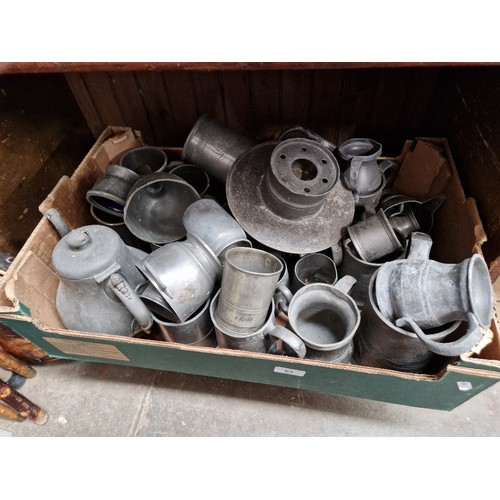 63 - A box of metal ware including pewter