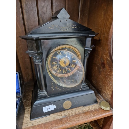 64 - A black slate mantle clock, presentation inscription dated 1883