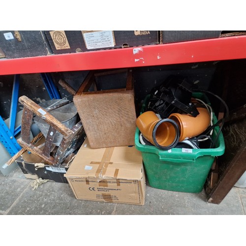 94 - A box of metalware  including galvanised bucket, shoe last, bath lift, a box of drainage plastic pip... 