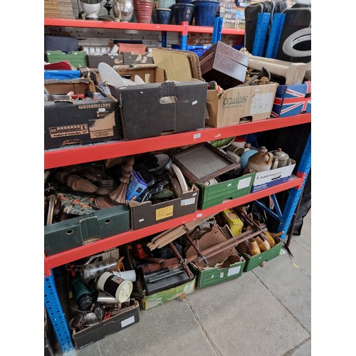 132 - 12 boxes of assorted items including pottery, treen, stoneware, radios, clogs, metal ware etc