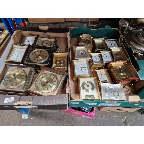 123 - Two boxes of assorted carriage & Mantle clocks.