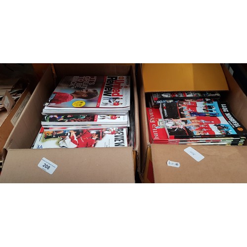 208 - Three boxes of Manchester United football programmes.