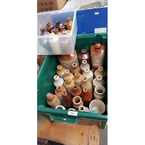 340 - A box of assorted stone ware bottles including ginger beers etc.