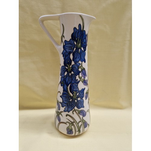 471 - A Moorcroft tall water jug, Delphinium, designed by Kerry Godwin