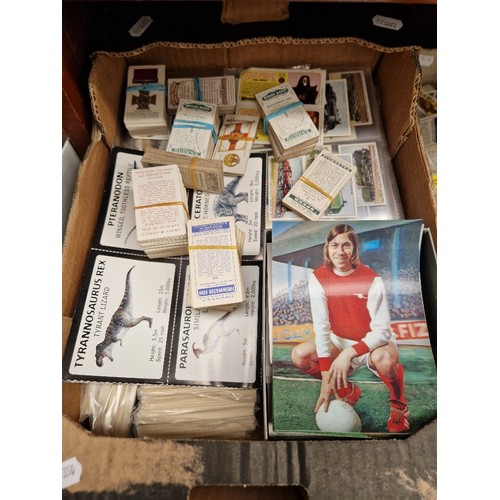 32 - A box of assorted cigarette cards.