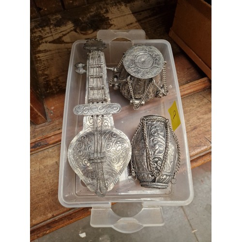 23 - Three Indian white metal novelty trinket boxes modelled as musical instruments.