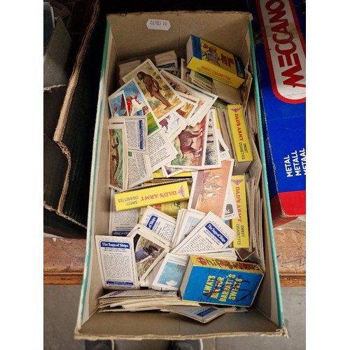 36 - A box of assorted tea cards.