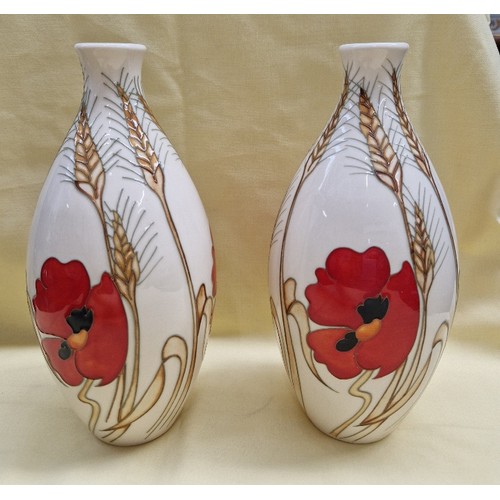 472 - A pair of Moorcroft vases, Harvest Poppy on cream ground, height appx 25cm