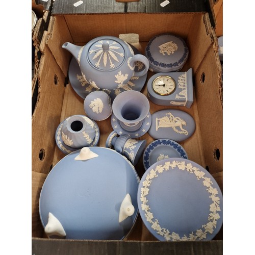 475 - A box of blue and white Wedgwood jasperware including teapot and footed bowl.