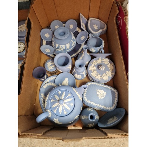 476 - A box of blue and white Wedgwood jasperware including teapot.