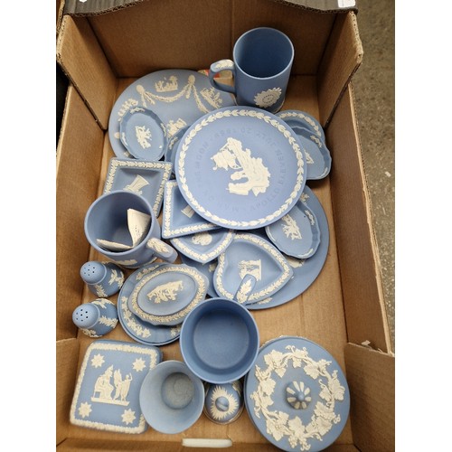 485 - A box of ble and white Wedgwood jasperware including Apollo 11 plate.