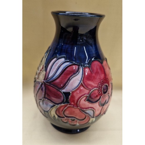 462 - Moorcroft bulbous vase, Anemone pattern on dark blue ground, height 13cm