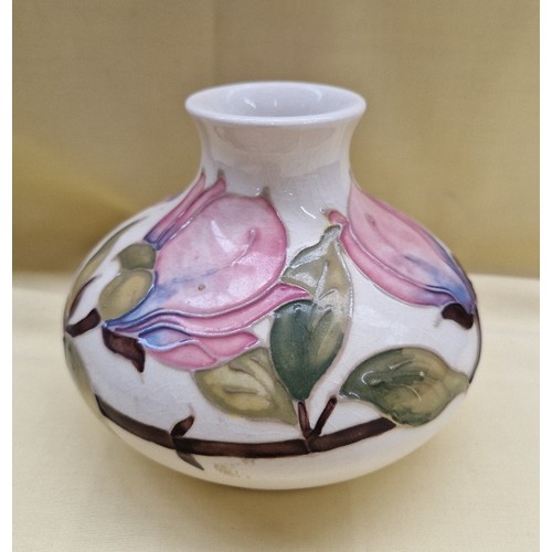 465 - Moorcroft squat bulbous vase, pink hibiscus on cream ground, height appx 10.5cm