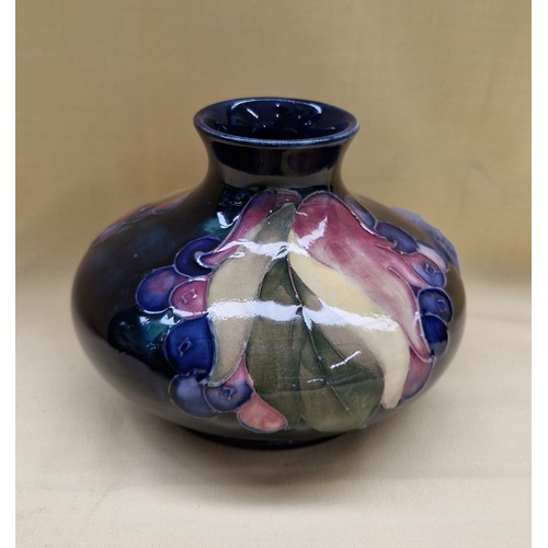 452 - Moorcroft squat vase, Leaves and Berries pattern on cobalt blue ground, signed to base, height 8cm, ... 