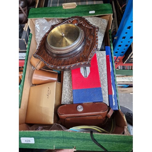 426 - A box of assorted items including cutlery, barometer mounted on oak, and Agfa folding camera, model ... 