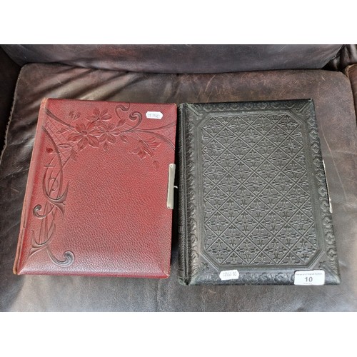 10 - Two vintage photograph albums and contents.