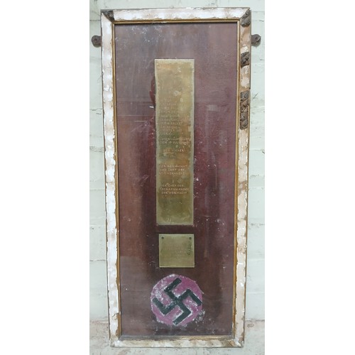 52 - A frame felt swastika and brass plaques bearing the signatures of Adolf Hitler (1889-1945), chief of... 