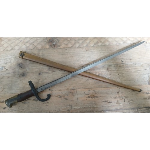 44 - A French 1879 St Etienne sword bayonet and scabbard, total length 66cm.