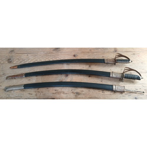 49 - A group of three Indian sabres with scabbards.