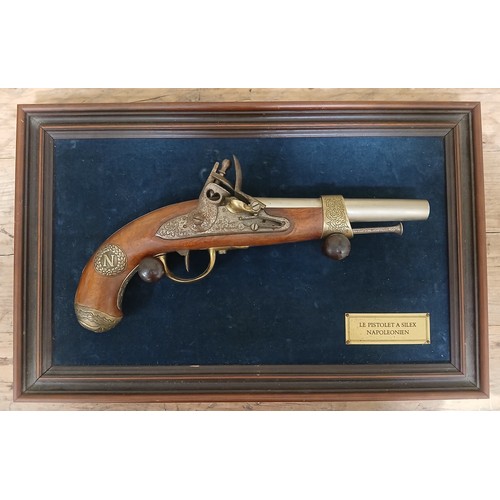 42 - A reproduction non-working replica flintlock pistol, mounted  on board with plaque 'Le Pistolet A Si... 