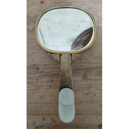 74 - An early 20th century Chinese carved jade and gilt metal mounted hand mirror, the 18th/19th century ... 