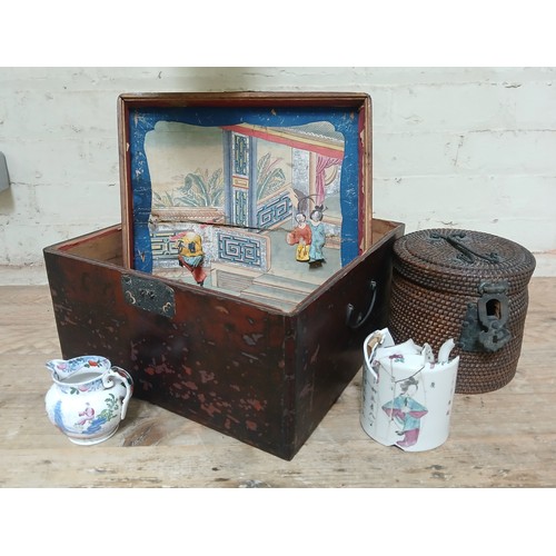 82 - Assorted oriental items comprising a Chinese porcelain tea pot (AF), a wicker teapot holder and a de... 