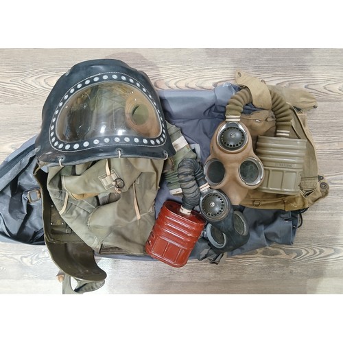 62 - A group of three WWII gas masks.