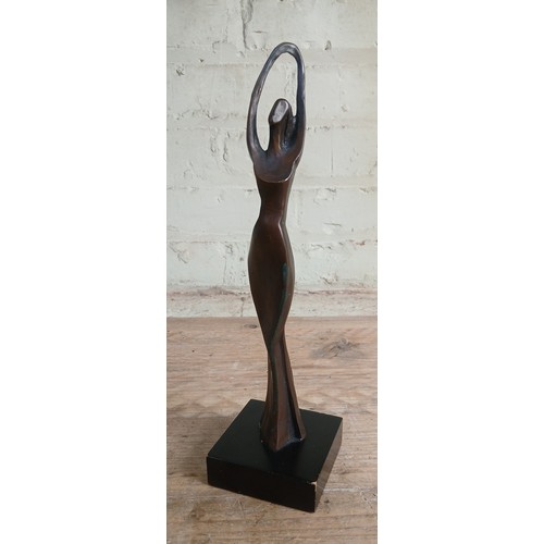 102 - Bernard Kim (Korean, b1942), modernist bronze figure of a female dancer, signed 'Kim B', on composit... 