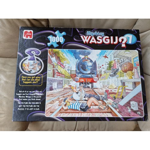 85 - A large collection of Wasgij puzzles, jigsaws, 3D puzzles, etc.