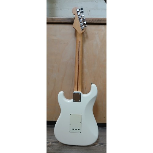 135 - A Fender Stratocaster Japanese electric guitar, white body, made in Japan, serial no. H031379.