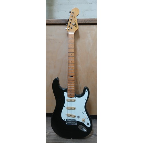 143 - A Marlin Slammer electric guitar, black body with white pick guard, serial no. 732101.