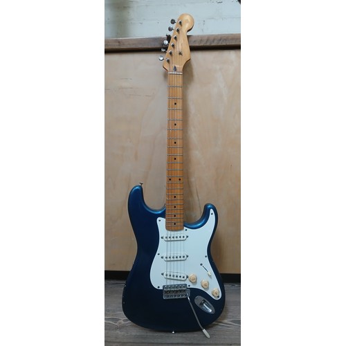 146 - A Stratocaster style electric guitar, metallic blue body, white pick guard, serial no. 20680.