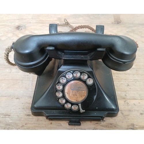 110 - A vintage black bakelite pyramid bakelite telephone.