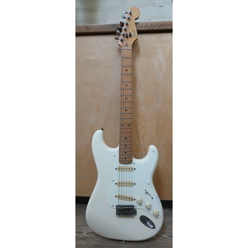 135 - A Fender Stratocaster Japanese electric guitar, white body, made in Japan, serial no. H031379.