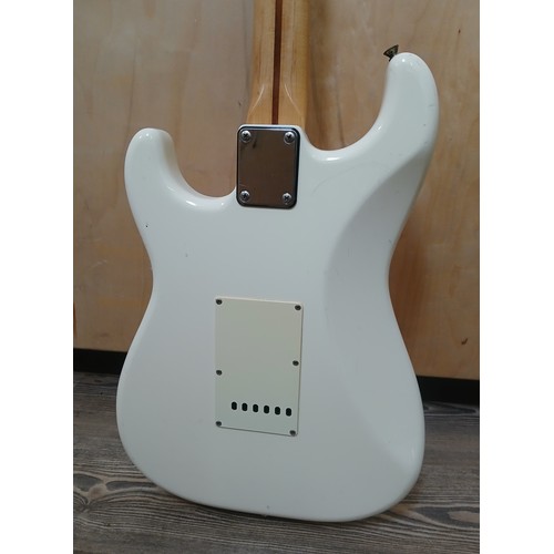 135 - A Fender Stratocaster Japanese electric guitar, white body, made in Japan, serial no. H031379.