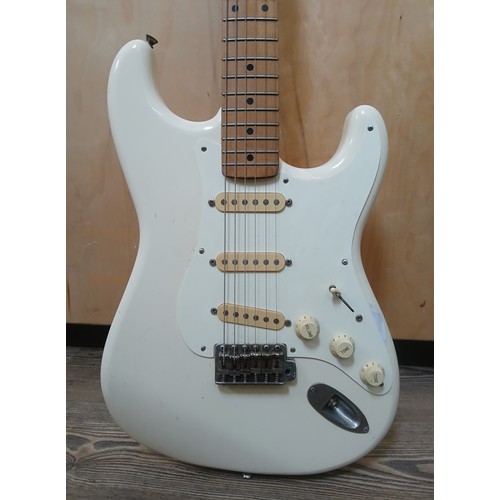 135 - A Fender Stratocaster Japanese electric guitar, white body, made in Japan, serial no. H031379.