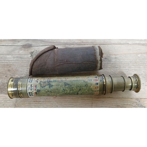 192 - A brass three three drawer telescope decoarted with flags, max length 42cm.